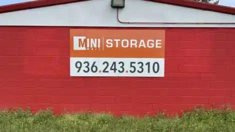 building with wall banner and customer service number